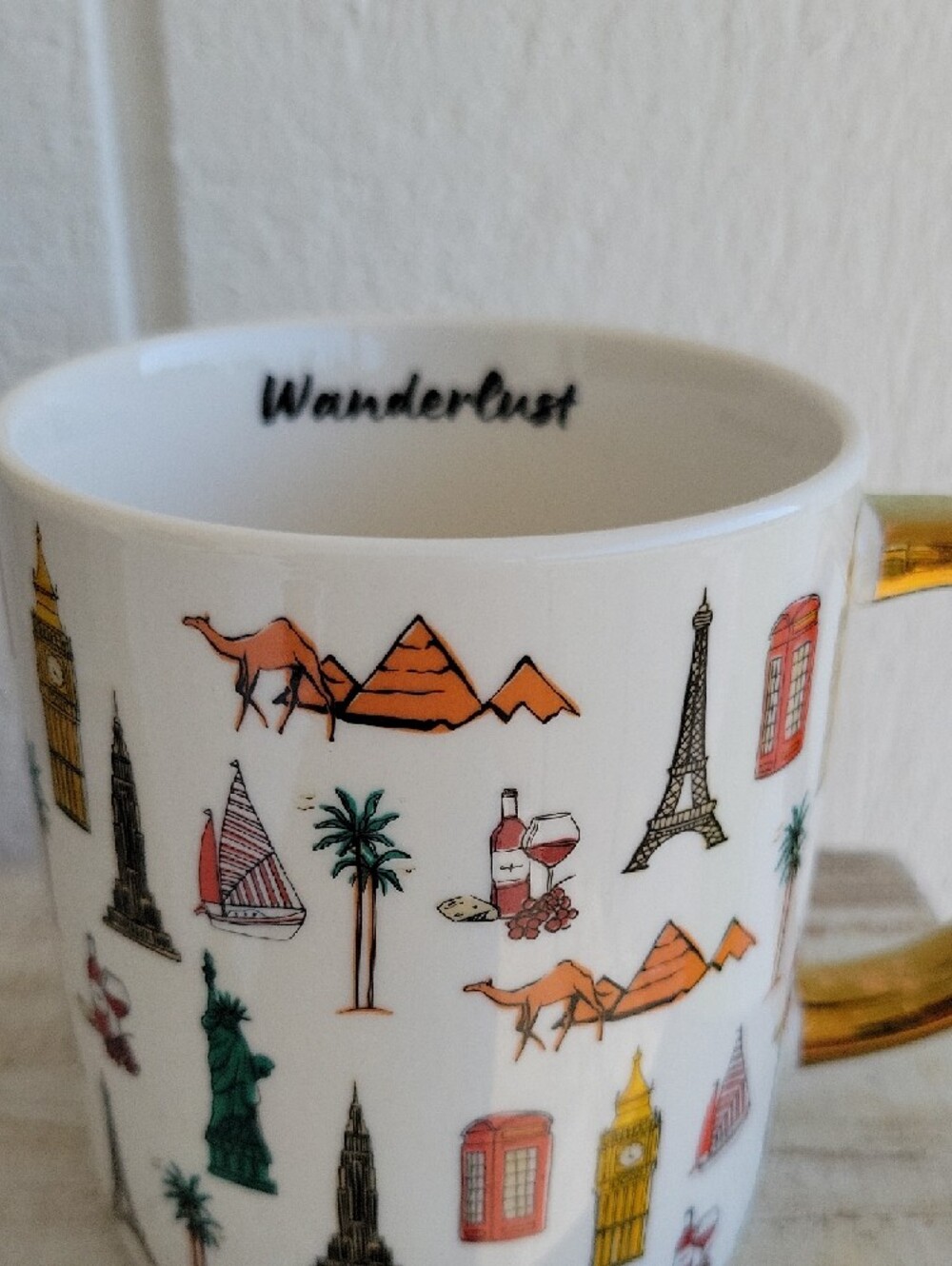 Wanderlust White Stoneware Mug with Gold Handle and Multicolor Travel Icons - Picture 3 of 8